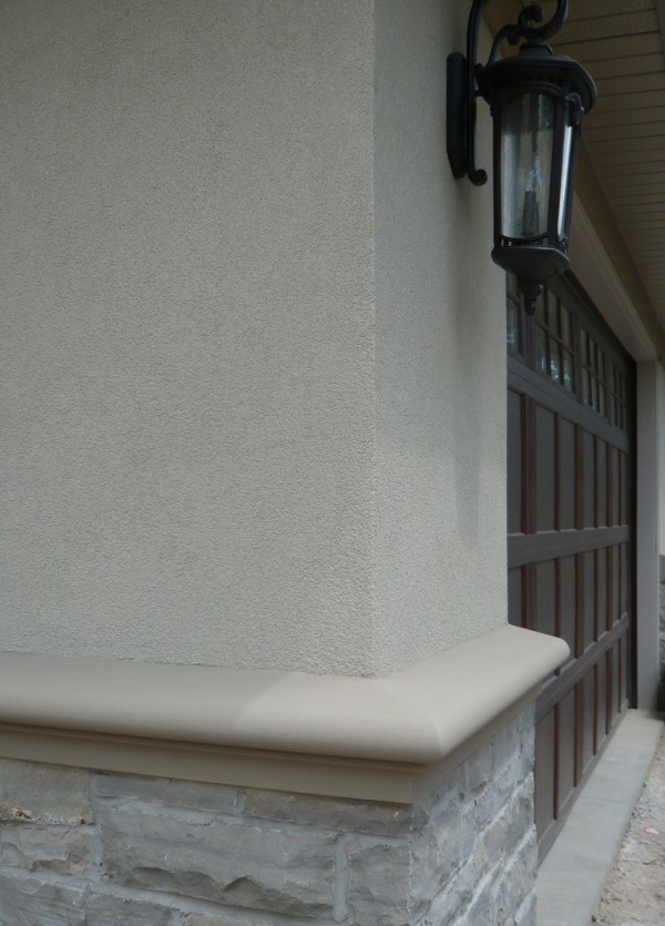 garage door stucco band